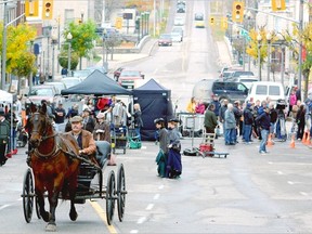A horse pulls a cart through downtown St. Marys Tuesday, where an episode of the CBC television series Murdock Mysteries. More than 100 actors and crew were in town for the one-day shoot. The city was compensated for all costs, as were merchants located on streets closed for filming. (SCOTT WISHART/QMI Agency)