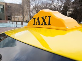 A Yellow taxi is seen outside of City Hall during a City of Edmonton press conference warning about the risks of taking bandit taxis on Halloween in Edmonton, Alta., on Tuesday, Oct. 28, 2014. Ian Kucerak/Edmonton Sun