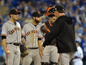 San Francisco Giants starting pitcher Jake Peavy (left) is relieved by manager Bruce Bochy in the second inning against the Kansas City Royals during game six of the 2014 World Series at Kauffman Stadium. (Denny Medley-USA TODAY Sports)