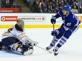Maple Leafs’ James van Riemsdyk hits the post behind Sabres goalie Michal Neuvirth at the Air Canada Centre Tuesday night. (Dave Able/Toronto Sun)