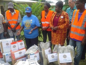 Members from the Rotary Club of Monrovia donate essential items to families quarantined by Ebola (Photo submitted).