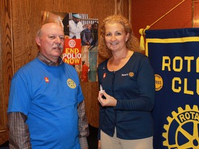 Rotary Club of Sarnia President Lawrie Lachapelle and Rotarian Tanya Wolff display one of the vessels that administers oral vaccinations for polio. The Rotary Club held a special presentation for members on Oct. 20, outlining the progress and challenges in the organization's fight against polio. CARL HNATYSHYN/SARNIA THIS WEEK/QMI AGENCY