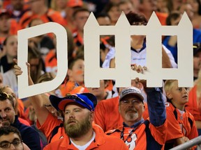 Fans hold a sign for the Denver Broncos defense late in a game between the Denver Broncos and the San Diego Chargers at Sports Authority Field at Mile High on October 23, 2014. (Doug Pensinger/Getty Images/AFP)