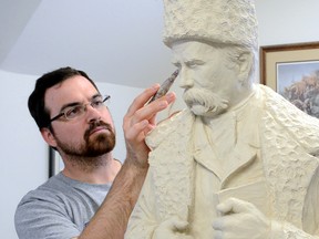 In this file photo, Tyler Fauvelle works on a sculpture of  Ukrainian poet Taras Shevchenko. The statue is scheduled to be unveiled in Kobzar Park in downtown Timmins.