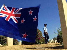 A soldier walks amongst graves of World War Two soldiers and past a New Zealand flag after a ceremony to mark the 70th anniversary of the Battle of El-Alamein in El-Alamein October 20, 2012.  REUTERS/Mohamed Abd El Ghany