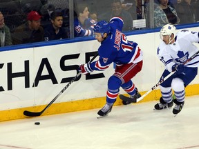 The NHL suspended Rangers defenceman John Moore (left) five games on Wednesday for his hit to the head of Wild forward Erik Haula. (Anthony Gruppuso/USA TODAY Sports/Files)