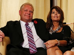 Doug Ford and his wife Karla watch the municipal election results after the closing of the polls in Toronto, October 27, 2014.  REUTERS/Mark Blinch