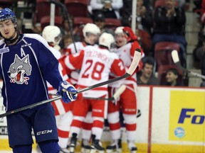 Sudbury Wolves defenceman Jeff Corbett skates to his bench after the Sault Greyhounds score a goal during a game on Oct. 22. (Steph Crosier/QMI AGENCY)