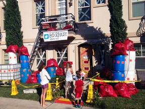 People visit a home decorated for Halloween to resemble an Ebola hot spot in University Park near Dallas, Texas. (JAMES W. FAULK/Handout via Reuters)