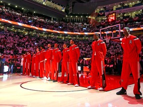 Raptors players prior to the start of Wednesday night's game against the Atlanta Hawks at the Air Canada Centre. (Dave Abel/Toronto Sun)