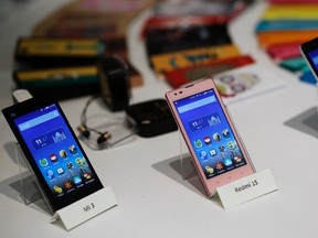 Three models of China's Xiaomi Mi phones are pictured during their launch in New Delhi in this July 15, 2014 file photo. REUTERS/Anindito Mukherjee/Files