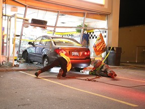 No serious injuries were reported when the elderly driver of a vehicle drove through the store front of Little Caesars Pizza on Lasalle Boulevard Wednesday night. Gino Donato/The Sudbury Star
