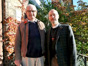 Rev. Lyndon Hutchison-Hounsell (right) and master gardener Tony Rudd stand in front of Church of St. John the Evangelist in London Ont. Oct. 29, 2014. St. John was one of 10 Anglican churches in Southwestern Ontario to take part in a program called Gardens4Bees — a project founded in London that encourages the planting of pollination gardens. CHRIS MONTANNI\LONDONER\QMI AGENCY