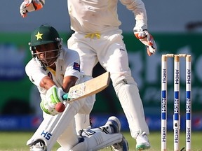 Pakistani batsman Younis Khan plays a shot during the fourth day of the first test cricket match between Pakistan and Australia at Dubai International Stadium. (AFP)