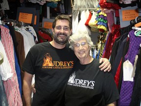 Scott Perrett and his mother Audrey stand in the middle of some of the costumes in Audrey's Costume Castle and Dancewear out in Kingston's west end. "Halloween is our Christmas," said Perrett. (Michael Lea/The Whig-Standard)