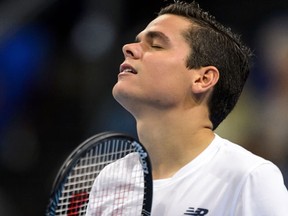 Milos Raonic of Canada reacts after missinga  point during his match against David Goffin of Belgium at the Swiss Indoors ATP 500 tennis tournament on October 24, 2014. (AFP PHOTO/FABRICE COFFRINI)