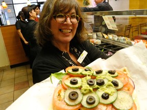 Rita DeMontis makes a Sun-sational sandwich at Subway for National Sandwich Day on Nov 3 on Monday October 27, 2014.(Michael Peake/Toronto Sun/QMI Agency)