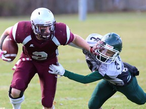 Frontenac Falcons' Dustin Brogaard gets away from Holy Cross Crusaders' Justus Masucol during Kingston Area senior AAA football semifinal action at Holy Cross on Thursday. (IAN MACALPINE/THE  WHIG-STANDARD)