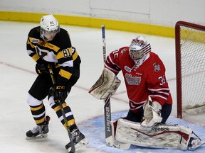 Kingston Frontenac Conor McGlynn deflects the puck in front of Oshawa Generals goalie Ken Appleby during OHL action in at the Rogers K-Rock Centre on September 5 2014. (IAN MACALPINE/KINGSTON WHIG-STANDARD/QMI AGENCY)