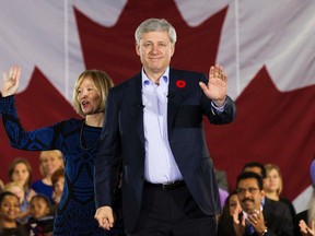 Canada's Prime Minister Stephen Harper arrives with his wife Laureen to speak at the Joseph & Wolf Lebovic Jewish Community Campus in front of an audience of school children in Vaughan, October 30, 2014. Canadian Prime Minister Harper unveiled on Thursday family tax cuts and benefits totaling C$26.76 billion ($23.89 billion) over six years, including C$3.07 billion for the fiscal year that ends next March and C$4.62 billion for 2015-16.    REUTERS/Mark Blinch