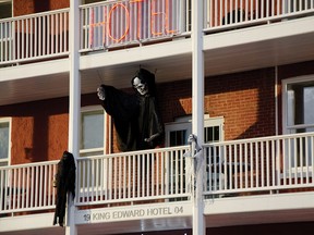 A grimm figure hangs from the balcony of the King Edward Hotel. What spooky events are happening this Halloween in Pincher Creek?