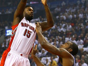 Raptors’ Amir Johnson (left) shoots over the Hawks’ Paul Millsap on Wednesday. For the first time in a long time, Johnson says he’s finally healthy, although admits that his stamina is quite there just yet. (Dave Abel/Toronto Sun)