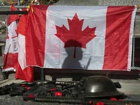 The Royal Canadian Regiment at the National War Monument in Ottawa Thursday. Thousands of people have left flowers and notes at the memorial to remember Cpl. Nathan Cirillo who was killed at the memorial last week. (Tony Caldwell/QMI Agency)