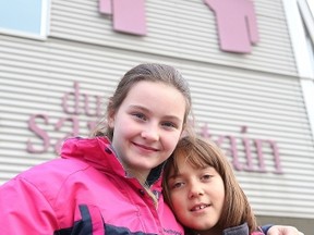 Gino Donato/The Sudbury Star
Eleven-year-old Kailey Essiembre and nine-year-old Mikaila Jacques-McKenzie will be donating their halloween treats to clients of the Samaritan Centre.