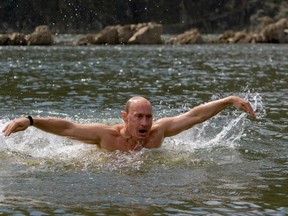 Russia's Prime Minister Vladimir Putin swims in a lake in southern Siberia's Tuva region in this August 3, 2009 file photo. (REUTERS/RIA Novosti/Kremlin/Alexei Druzhinin/Files)