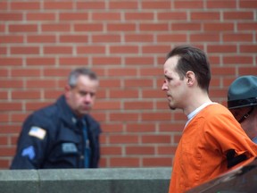 Eric Matthew Frein is taken by police officers into Pike County Courthouse for an arraignment in Milford, Pennsylvania, October 31, 2014. (REUTERS/Mark Makela)