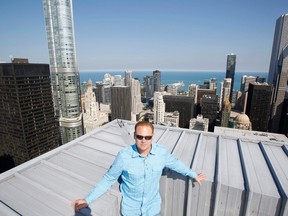 Daredevil Nik Wallenda poses for a photo on the rooftop of the Leo Burnett Building in Chicago September 17, 2014.  Wallenda, who plans a high-wire walk between Chicago skyscrapers this November, says that for his family of acrobats, it is completely normal to be on a cable way up in the air - though it may look wild to everyone else. REUTERS/Jim Young