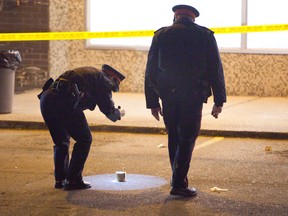 Toronto Police at the scene of a fatal shooting at a plaza at Keele and Sheppard Oct. 30, 2014. (MANNY RODRIGUES PHOTO)