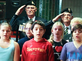 Grade 6 students joined veterans at the Spadina subway station to kick off this year's poppy campaign. (VERONICA HENRI, Toronto Sun)