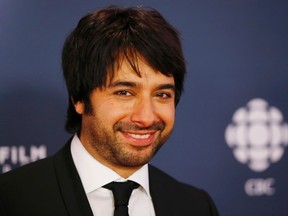 Jian Ghomeshi arrives on the red carpet at the 2014 Canadian Screen awards in Toronto, March 9, 2014. (Reuters)