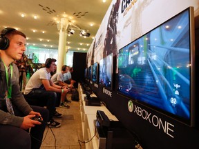 A gamer plays "Call of Duty: Advanced Warfare" on an Xbox One console during the Xbox Play Day 2014, before the Gamescom 2014 fair in Cologne August 12, 2014. (File photo)