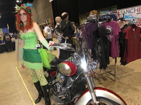 Jackie poses with a motorcycle at Comic Con, Friday, Oct. 31, 2014.