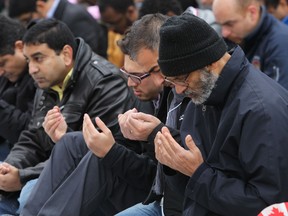 The Muslim association of Canada holds prayers offering condolences to the victims of violence in Ottawa and Montreal at the Alberta Legislature in Edmonton, Alberta on Friday, October 31, 2014. Perry Mah/Edmonton Sun