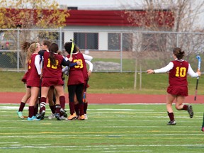 Regiopolis-Notre Dame Panthers players celebrate their game-winning goal against the Holy Cross Crusaders in the Kingston Area high school girls field hockey final CaraCo Home Field at the Invista Centre on Friday. The Panthers won 1-0 on a last-minute goal by Mikayla Rostek.
(IAN MACALPINE/THE WHIG-STANDARD)