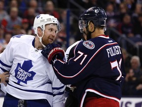 Maple Leafs' Leo Komarov (left) gets a jab to the face by Columbus Blue Jackets left wing Nick Foligno during a stop in play in the second period at Nationwide Arena in Columbus on Friday night. (USA TODAY SPORTS/PHOTO)