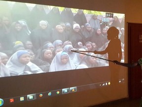 A student who escaped when Boko Haram rebels stormed a school and abducted schoolgirls, identifies her schoolmates from a video released by the Islamist rebel group at the Government House in Maiduguri, Borno State in this May 15, 2014 file photo. REUTERS/Stringer
