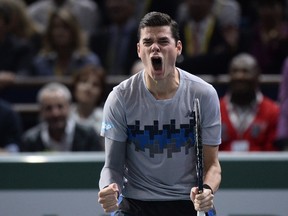 Canada's Milos Raonic celebrates his victory against Czech Republic's Tomas Berdych during the semifinals of the ATP World Tour Masters indoor tennis tournament on November 1, 2014 at the Bercy Palais-Omnisport. (AFP PHOTO/MIGUEL MEDINA)