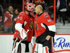 Oct 18, 2014; Ottawa, Ontario, CAN; Ottawa Senators goalie Robin Lehner (40) celebrates the win over the Columbus Blue Jackets with teammate Craig Anderson (41) at Canadian Tire Centre. Mandatory Credit: Eric Bolte-USA TODAY Sports