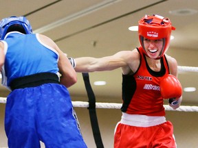 Mandy Bujold (in red) beat Amanda Galle in the 51 kg final at the Canadian boxing championship on Nov. 1 in Mississauga. (Veronica Henri, Toronto Sun)