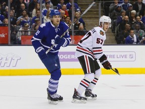 Maple Leafs forward James van Riemsdyk (left) played against his brother, Chicago Blackhawks defenceman Trevor van Riemsdyk (right), last night for the first time in the NHL (JOHN E. SOKOLOWSKI/USA Today Sports)