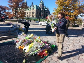 All of the flowers and mementoes left in honour of  slain soldier Cpl. Nathan Cirillo were removed from the National War Memorial on Sunday, Nov. 2, 2014. Anything that is not a flower will be sent to families of the fallen soldiers. The flowers will be delivered to veterans' homes.
Danielle Bell/Ottawa Sun/QMI AGENCY