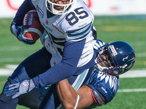 Argos receiver John Chiles tries to get away from Billy Parker of the Montreal Alouettes on Nov. 2. (Joel Lemay, QMI Agency)