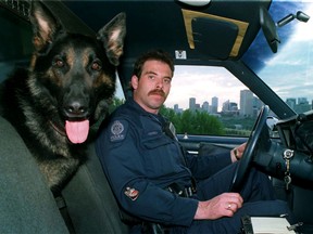 Edmonton Police Service Dog  "Ricco" and his handler Constable Doug Green sit in a police car on top of Connors Hill in Edmonton Alta on June 18, 1997. Tom Braid/Edmonton Sun/QMI Agency