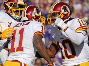 Washington Redskins wide receiver DeSean Jackson (11) celebrates his touchdown with quarterback Robert Griffin (10) during the third quarter against the Minnesota Vikings at TCF Bank Stadium. The Vikings defeated the Redskins 29-26. (Brace Hemmelgarn-USA TODAY Sports)
