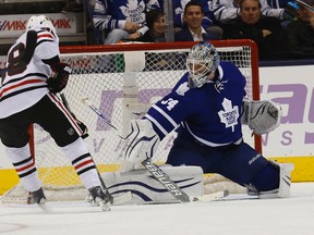 Maple Leafs goalie James Reimer stops the Chicago Blackhawks' Patrick Kane on Saturday night at the ACC. Reimer made 45 saves in the games. (Craig Robertson/Toronto Sun)