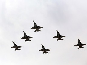 Six CF-18 Hornet fighter jets takes off from 4 Wing Cold Lake on Tuesday, October 21, 2014. The Canadian Armed Forces are providing the fighter jets to lend a hand in the fight against ISIS in Iraq. (TREVOR ROBB/QMI AGENCY files)